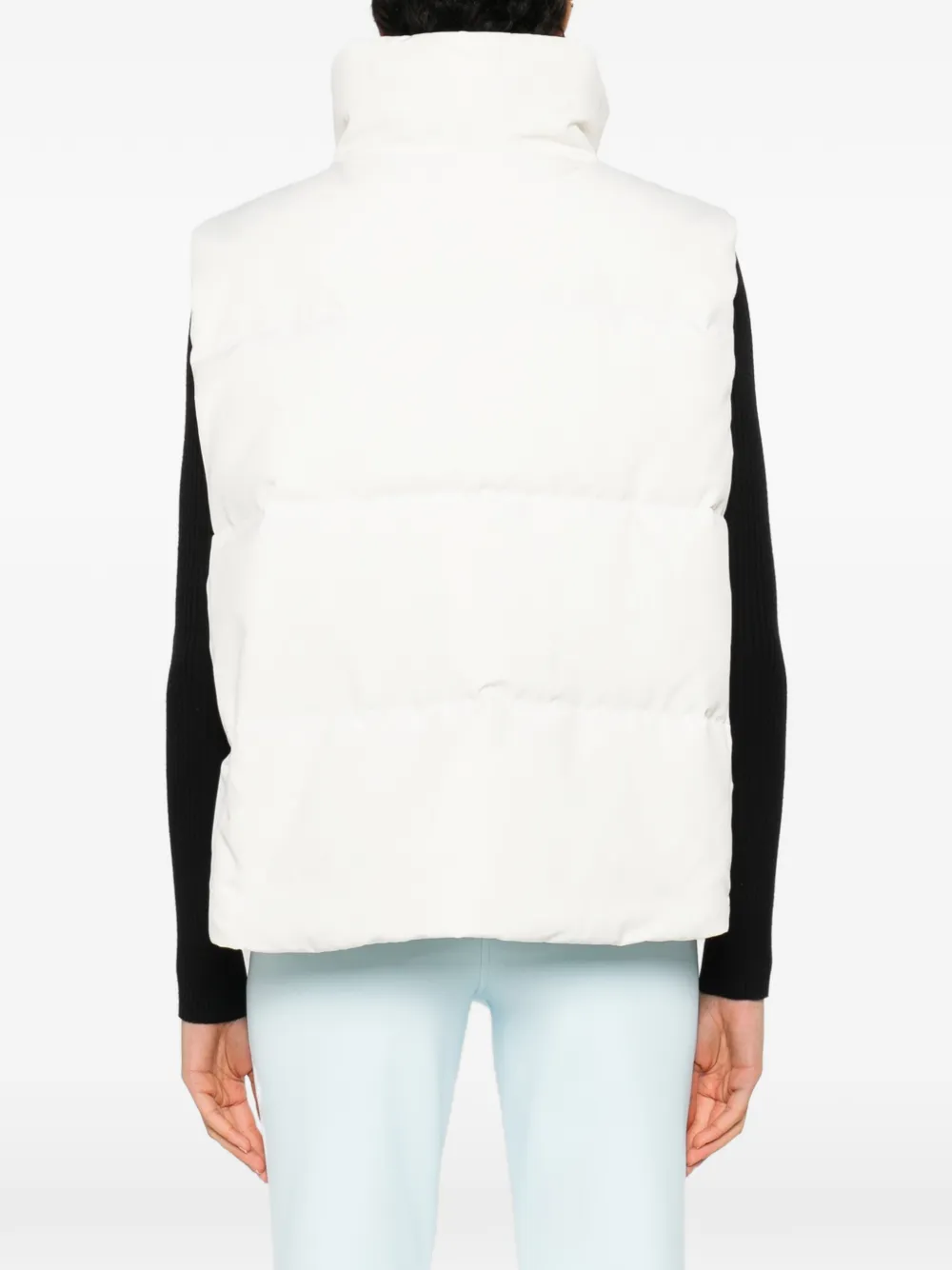 white vest worn by a person, showing the vest  fit