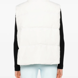 white vest worn by a person, showing the vest  fit
