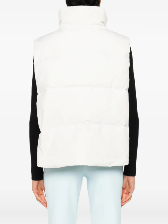 white vest worn by a person, showing the vest  fit
