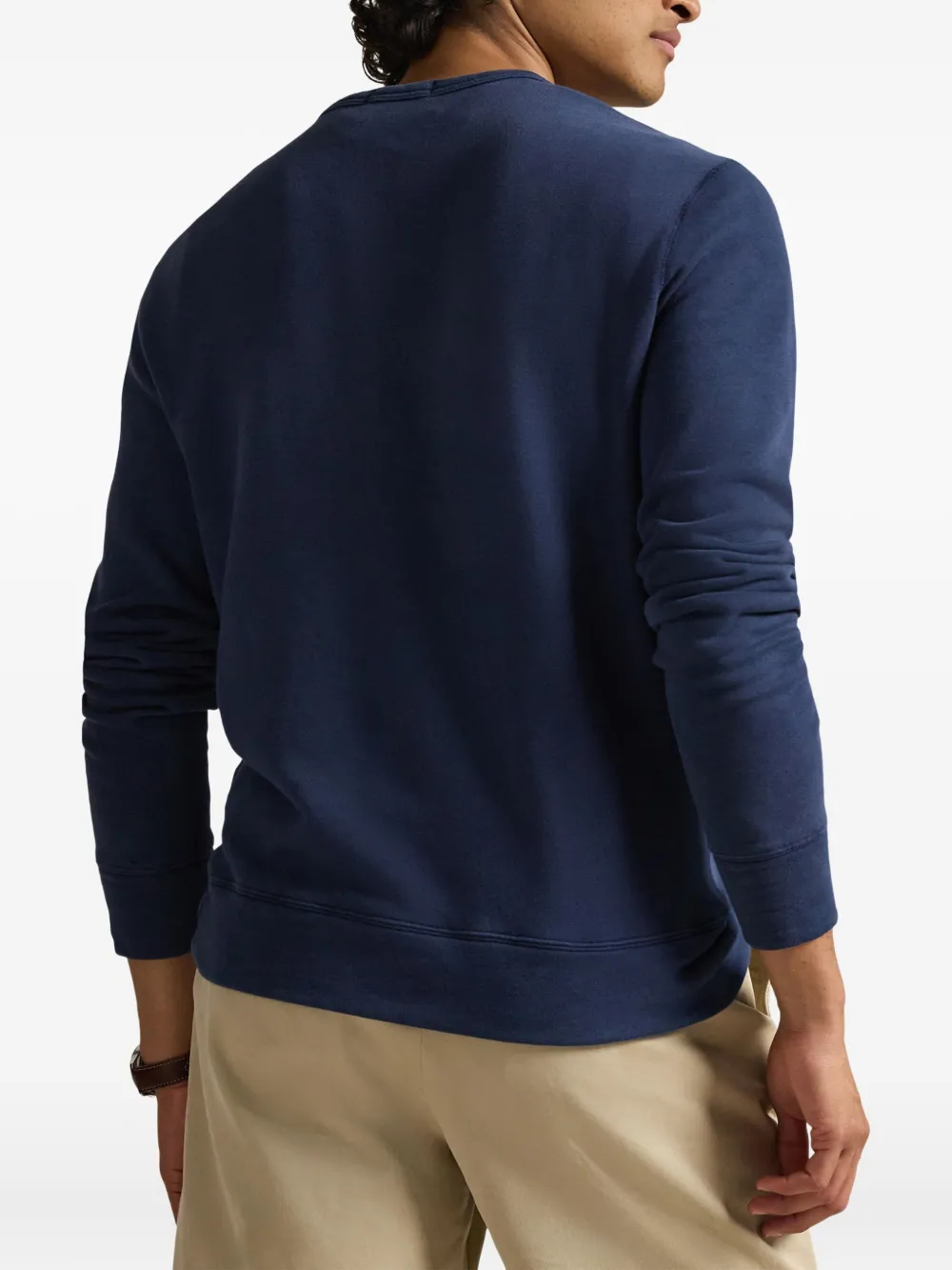 Blue sweatshirt worn by a person, showing the sweatshirt's  fit