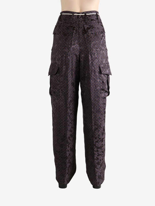 Brown pant worn by a person, showing the pant's fit