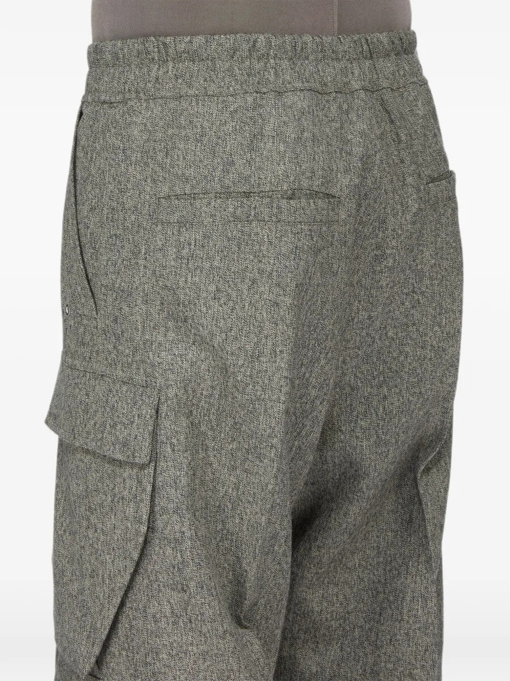 Grey pants worn by a person, showing the pants fit
