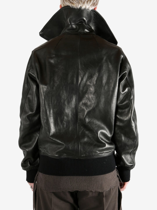 Black jacket worn by a person, showing the jacket's fit