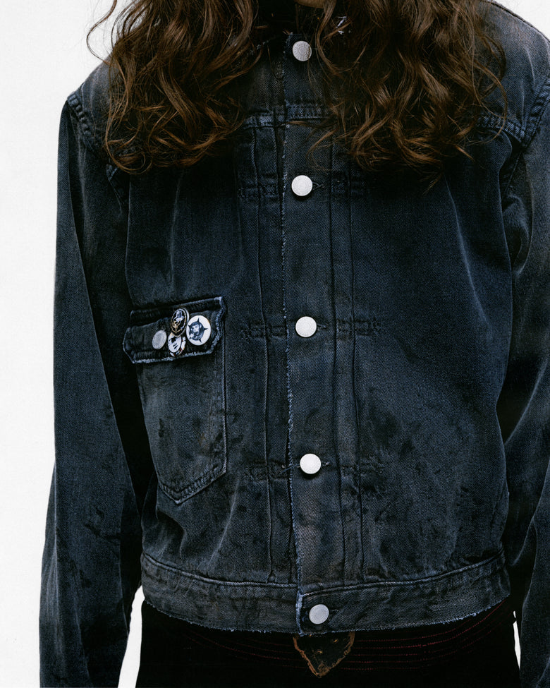 Close up of the grey jacket, showing texture of the cotton fabric