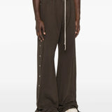 Brown pants worn by a person, showing the pants' fit