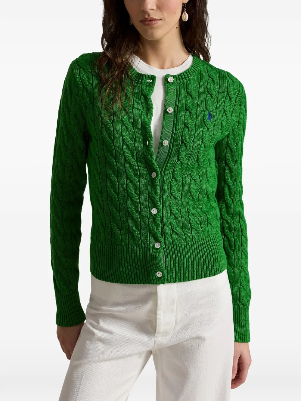 Green cardigan worn by a person, showing the cardigan's fit