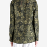 Green jacket worn by a person, showing the jacket fit