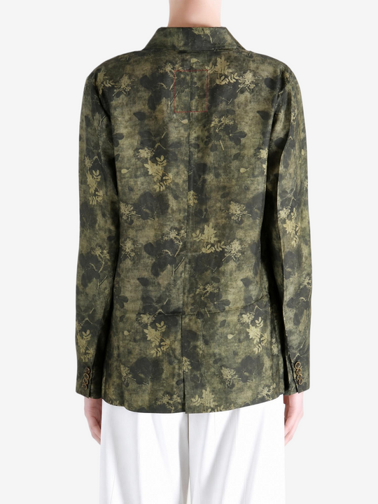 Green jacket worn by a person, showing the jacket fit
