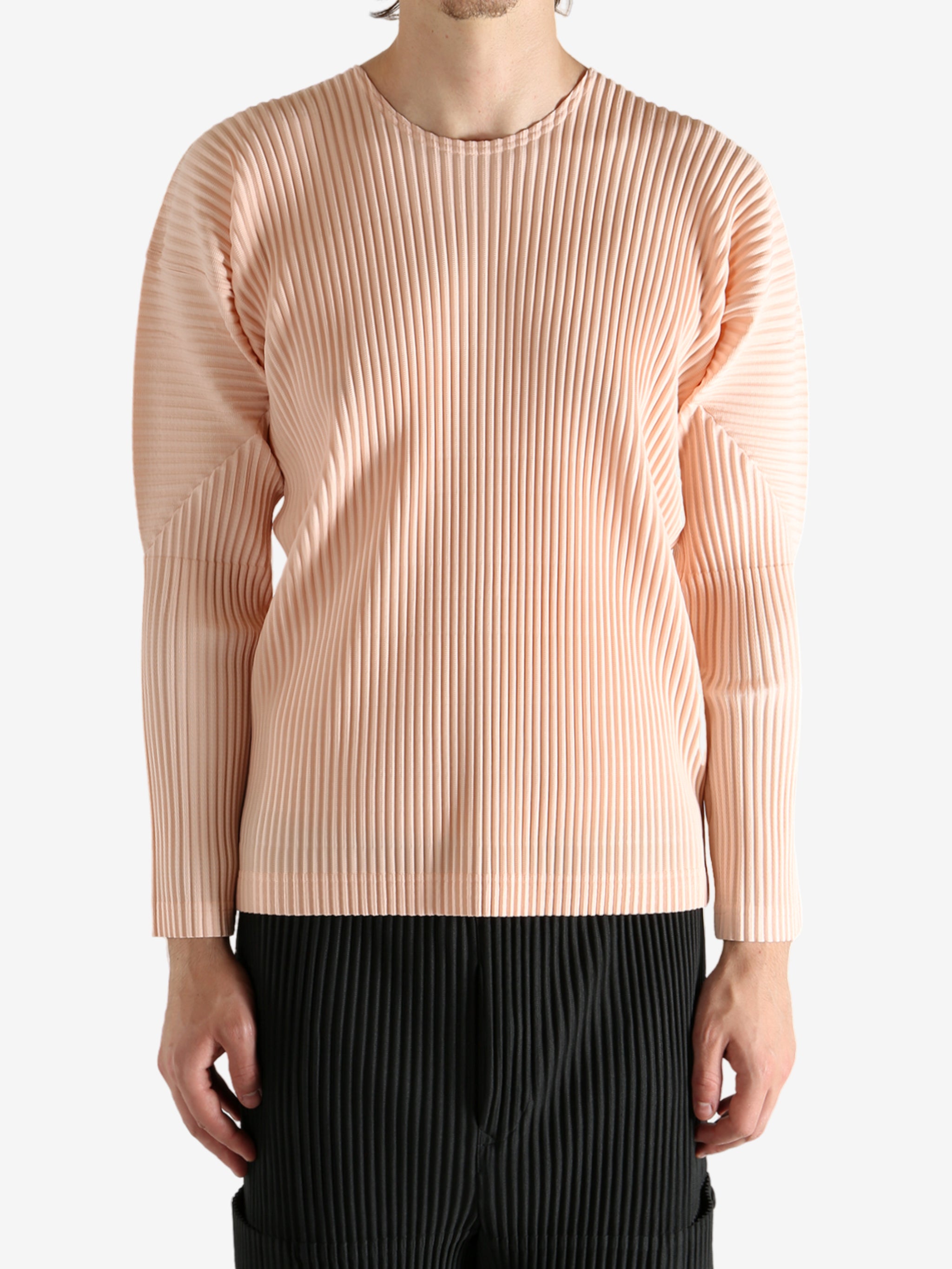 Pink shirts worn by a person, showing the shirt's fit