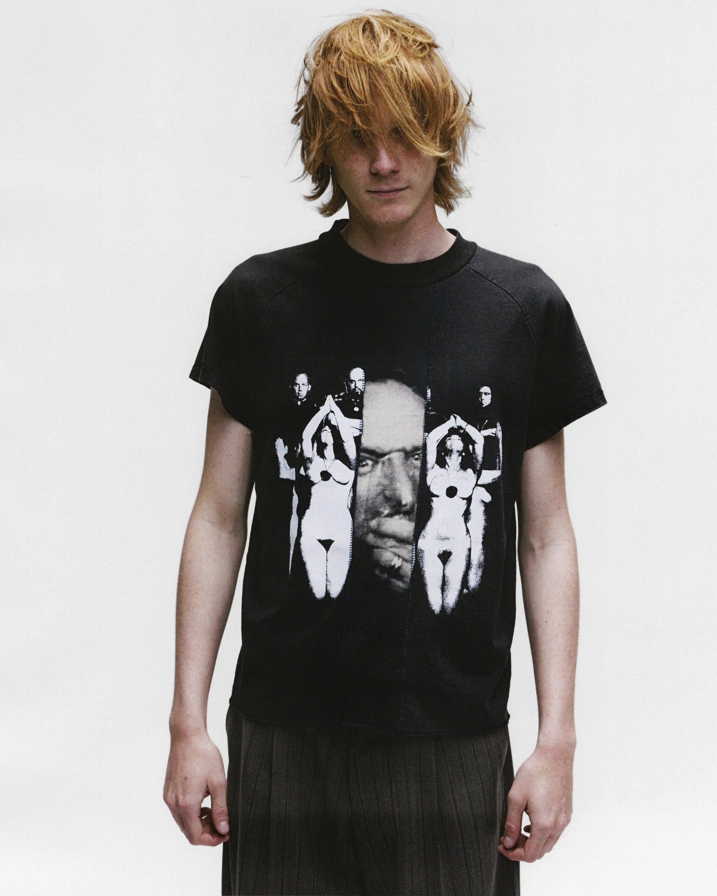 Black shirts worn by a person, showing the shirts fit