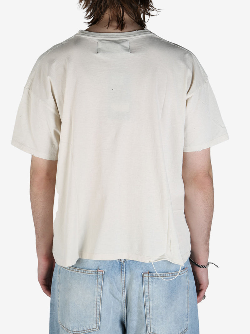 White T-shirt worn by a person, showing the T-shirt's fit