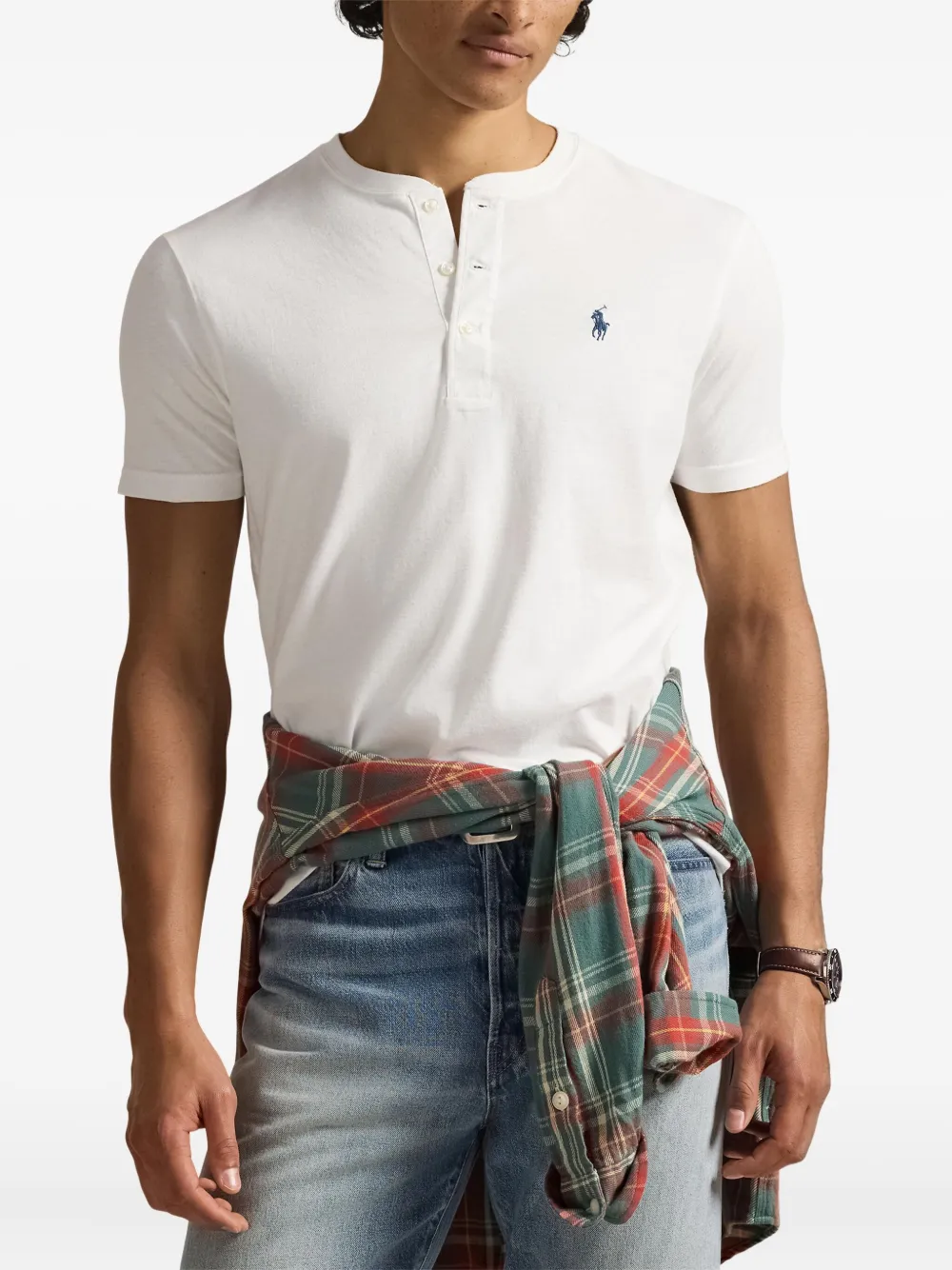 White t-shirt worn by a person, showing the t-shirt fit