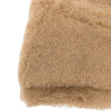 Close up of the tan hat, showing texture of the artificial fur fabric