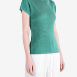 Green shirt worn by a person, showing the shirt fit