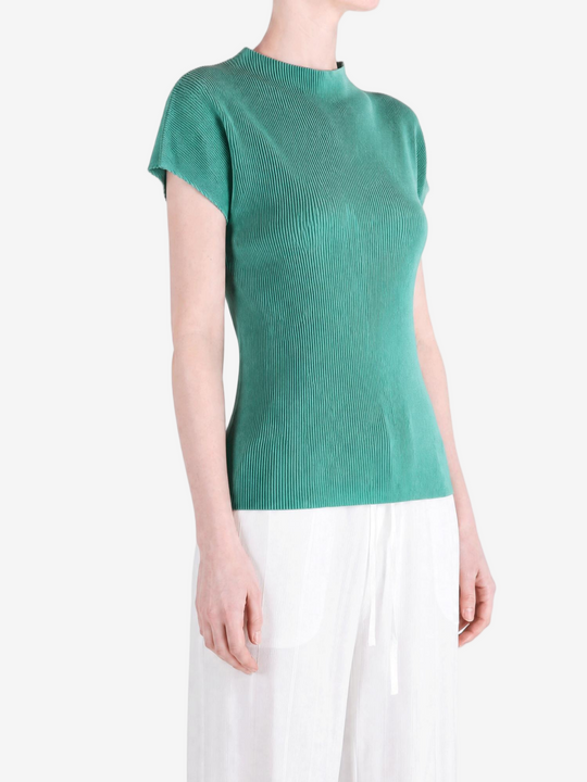Green shirt worn by a person, showing the shirt fit