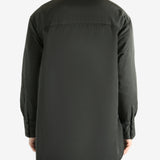 Black coat worn by a person, showing the coat's fit