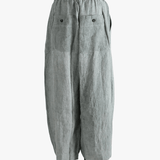 Gray pants worn by a person, showing the pants fit