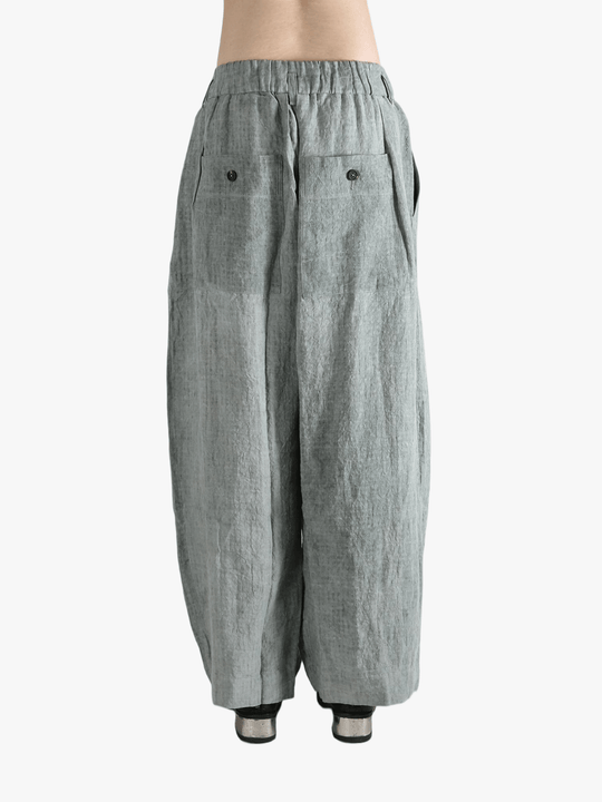 Gray pants worn by a person, showing the pants fit