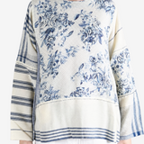 Blue top worn by a person, showing the top fit