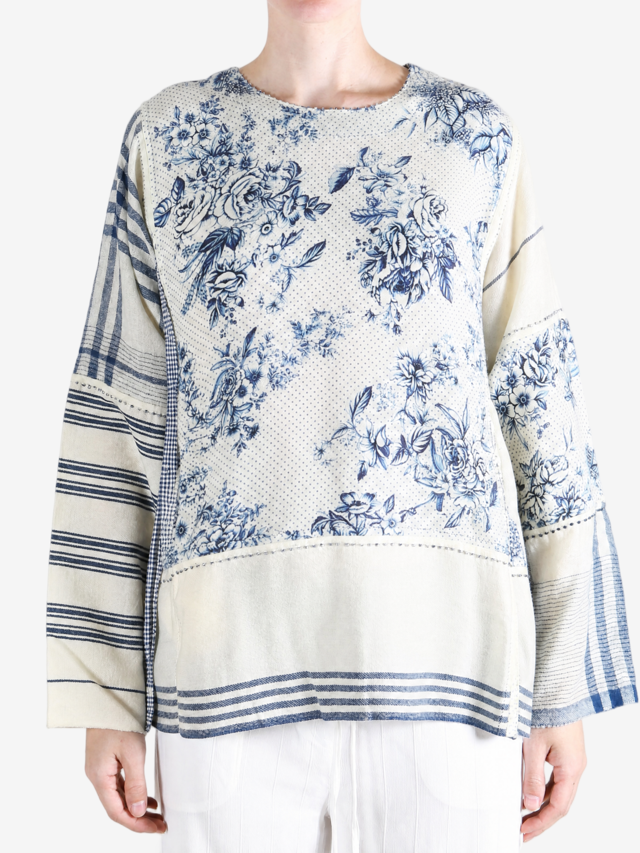 Blue top worn by a person, showing the top fit
