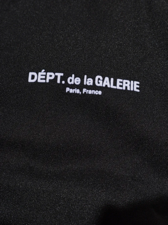 Close up of Black jacket, showing texture of the 100% polyester fabric