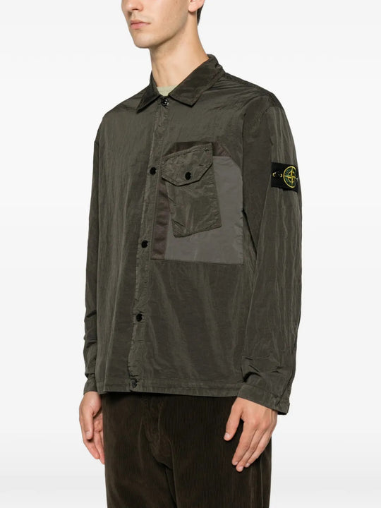 Green shirt worn by a person, showing the shirt fit