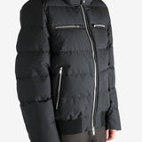 Black coat worn by a person, showing the coat's fit