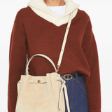 Tan bags worn by a person, showing the bags's fit
