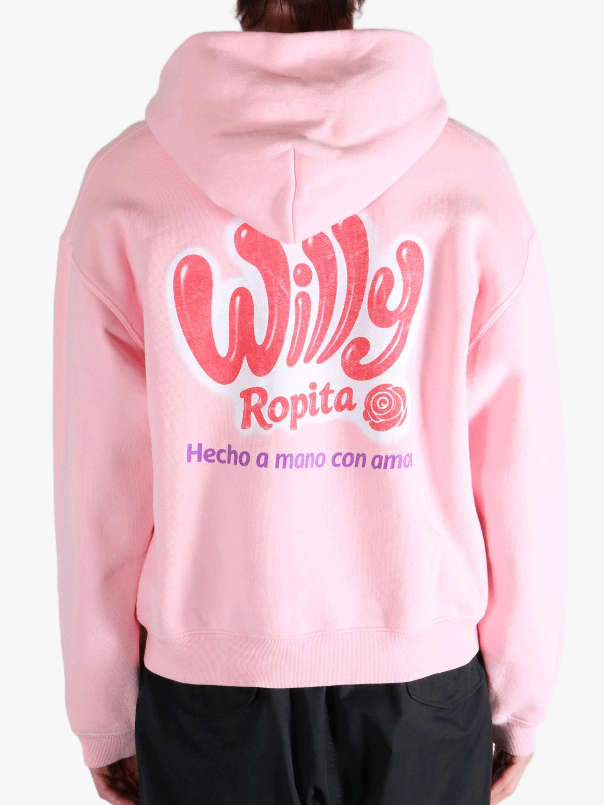 Pink hoodie worn by a person, showing the hoodie's fit