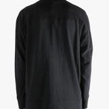 Black jacket worn by a person, showing jacket's fit