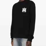 black sweat worn by a person, showing the sweat fit