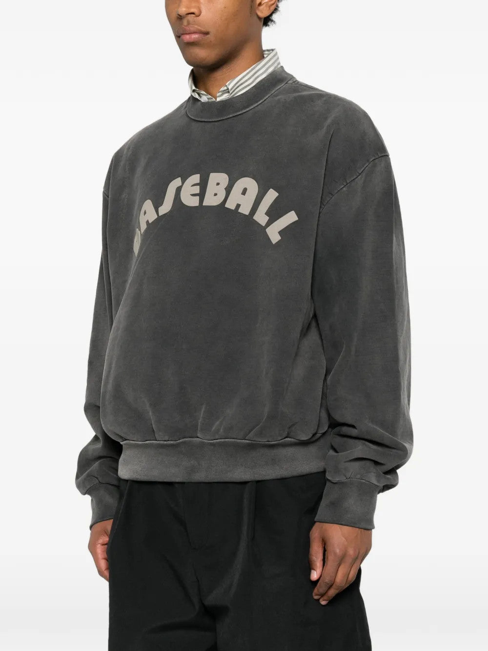 Grey hoodie worn by a person, showing the hoodie fit