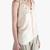 White top worn by a person, showing the top's fit