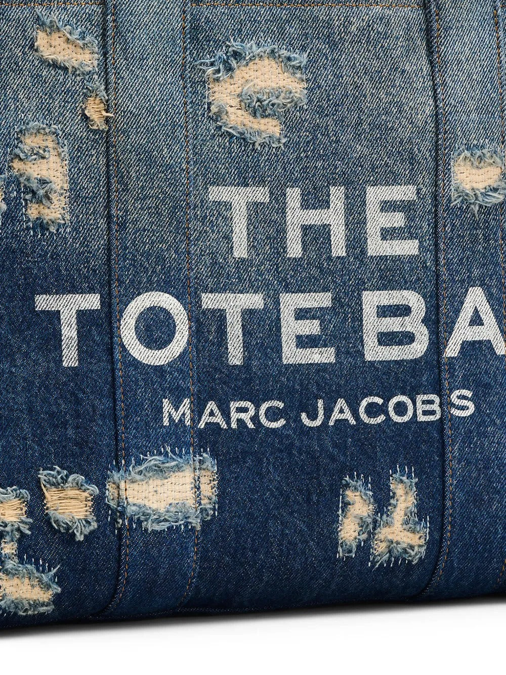 Close up of blue bag, showing texture of the cotton fabric