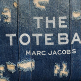 Close up of blue bag, showing texture of the cotton fabric