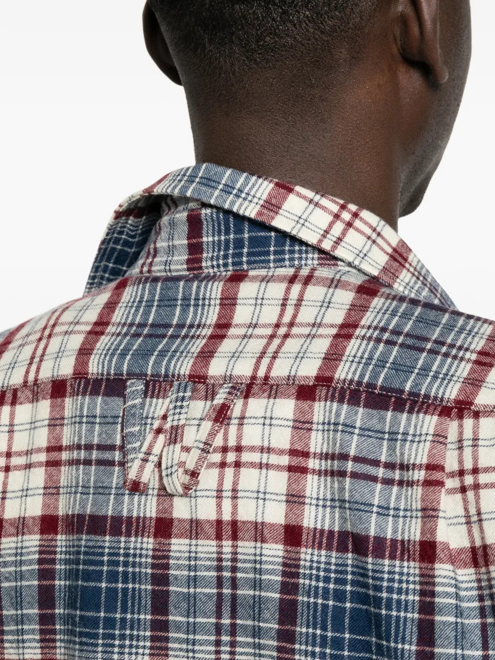 Blue shirt worn by a person, showing the shirt fit