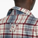 Blue shirt worn by a person, showing the shirt fit
