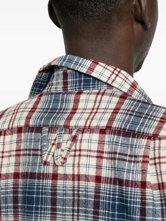 Blue shirt worn by a person, showing the shirt fit