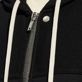 Close up of black Jacket, showing texture of the Cotton fabric