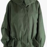 Green jacket worn by a person, showing the jacket's fit