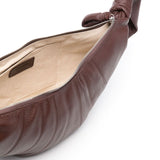 Close up of brown bag, showing internal patch pocket