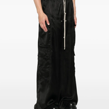 Black pants worn by a person, showing the pants fit