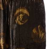 Close up of brown pants, showing texture of the viscose fabric