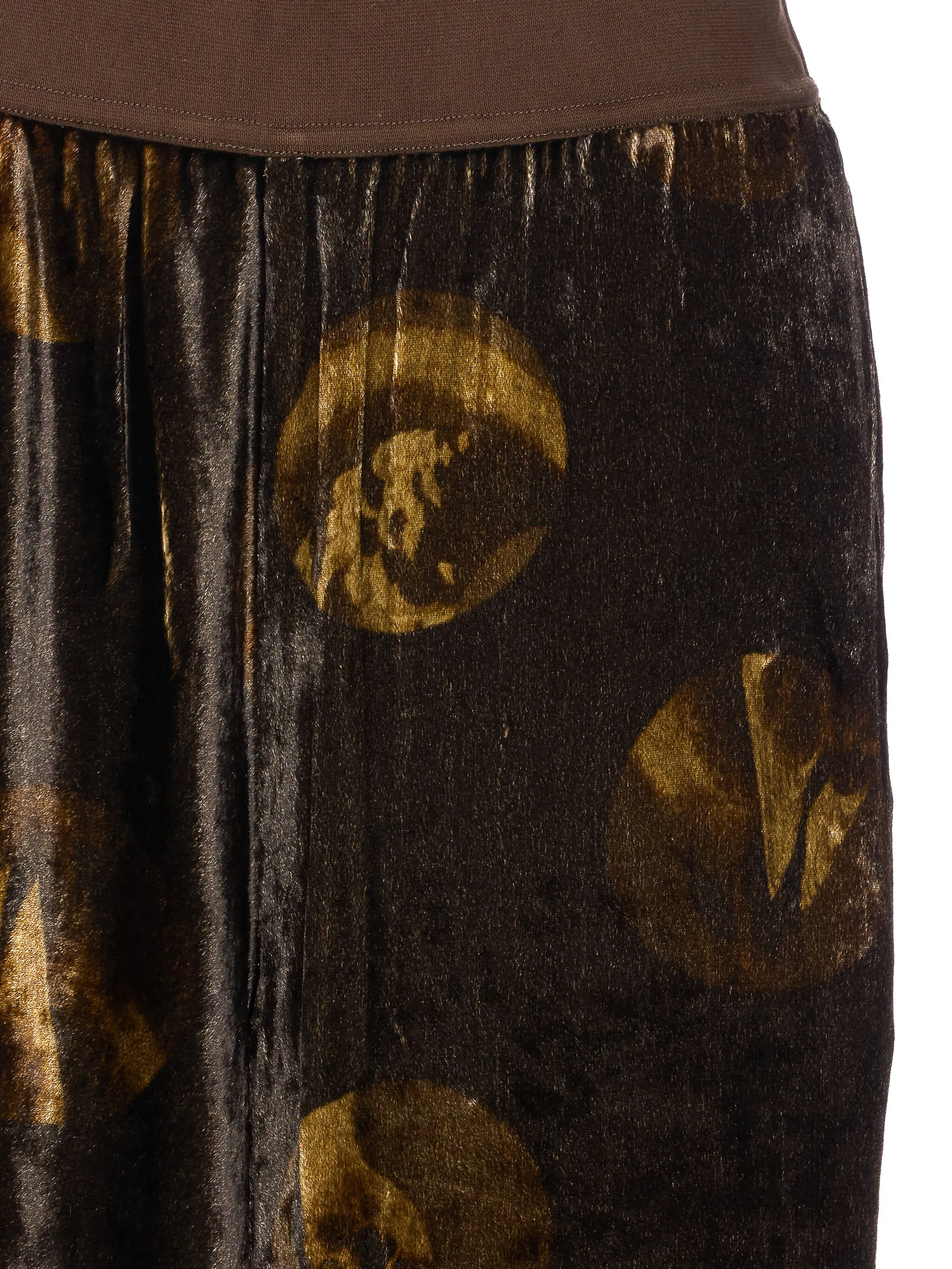 Close up of brown pants, showing texture of the viscose fabric