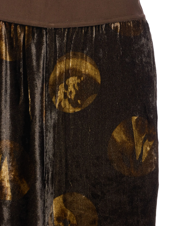 Close up of brown pants, showing texture of the viscose fabric