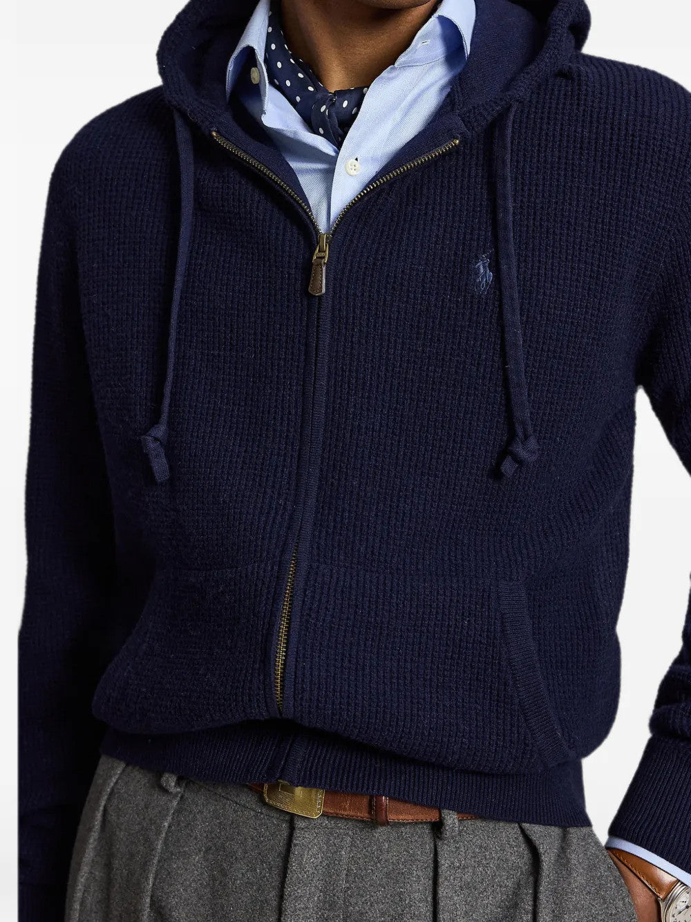Navy knitwear worn by a person, showing the knitwear fit