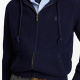 Navy knitwear worn by a person, showing the knitwear fit