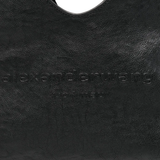 Close up of black bag,showing texture of the leather fabric.