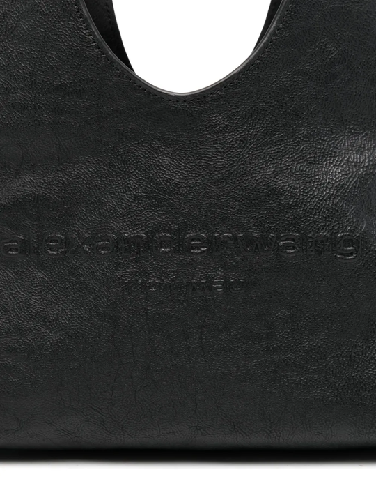Close up of black bag,showing texture of the leather fabric.