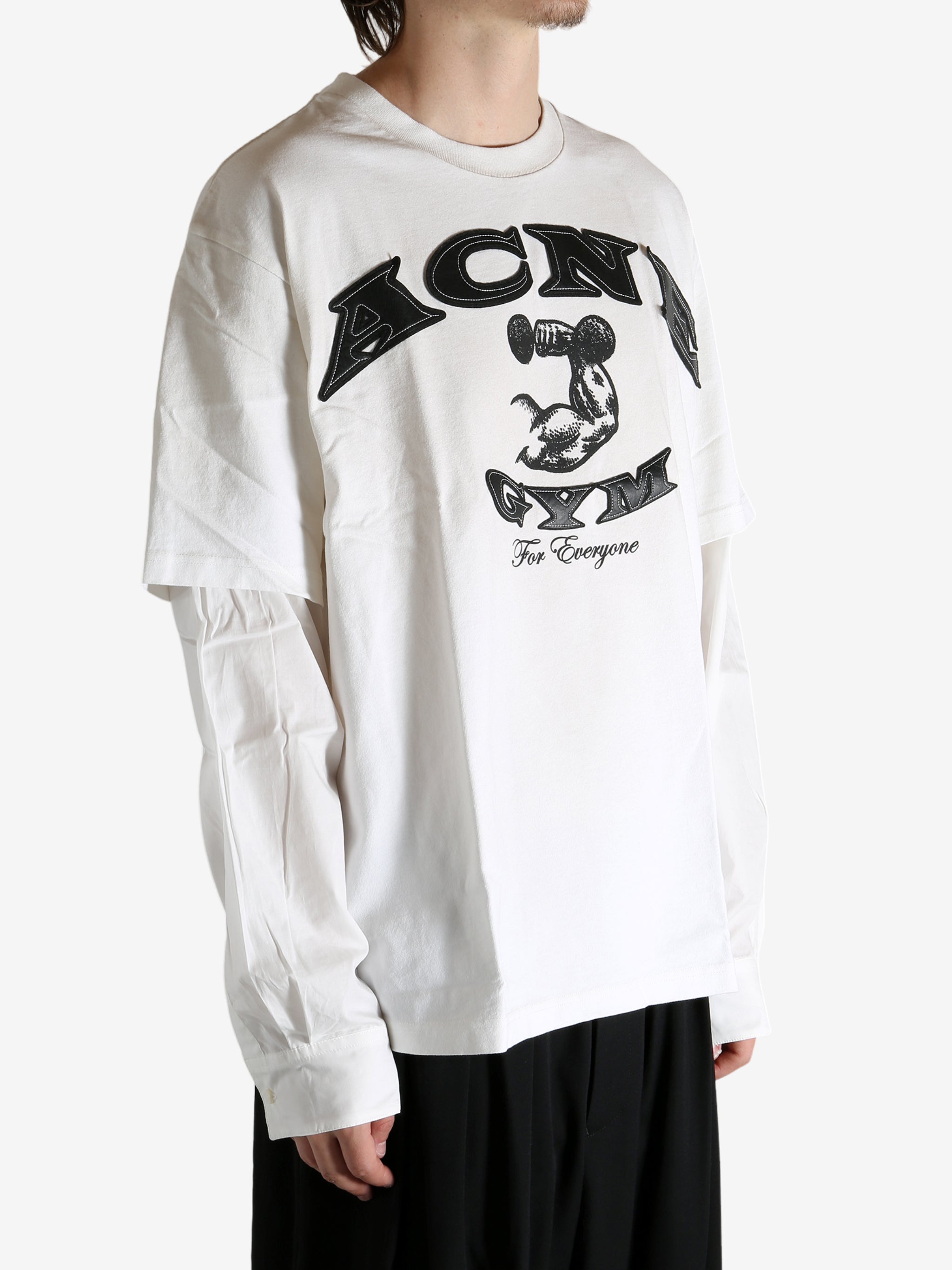 White T-shirt worn by a person, showing the T-shirt's fit